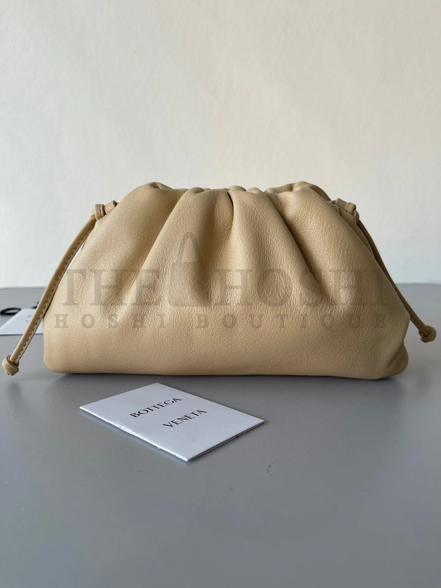 B0tt*ga Ven*ta Mini Pouch with Strap in Almond Calfskin Master Quality